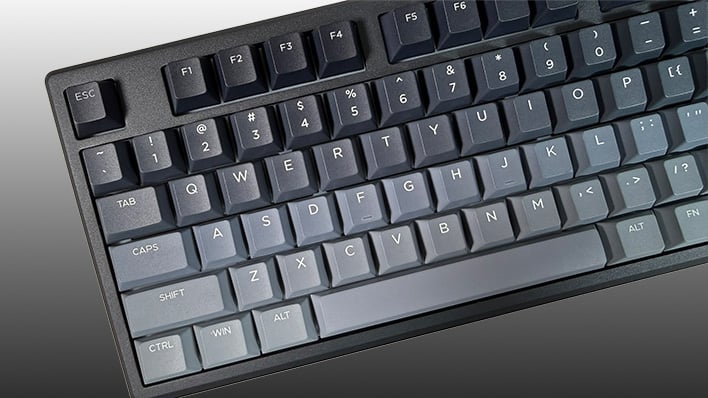 Closeup of the left side of the Epomaker Galaxy100 Lite keyboard, on a gray gradient background.