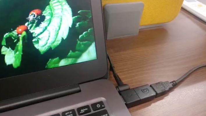 The BusKill cable's magnetic attachment triggers a screen lock when disconnected
