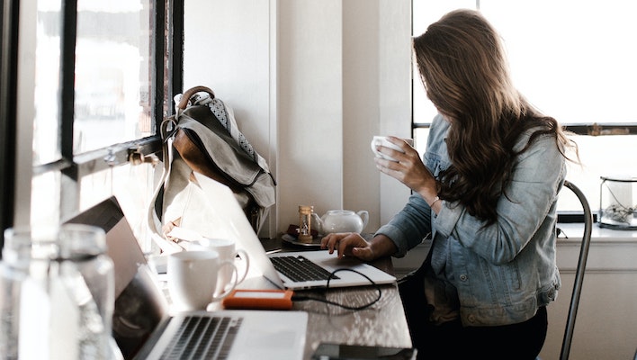 Woman working at MacBook