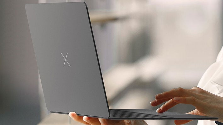 Craob X laptop open in hands (side view)