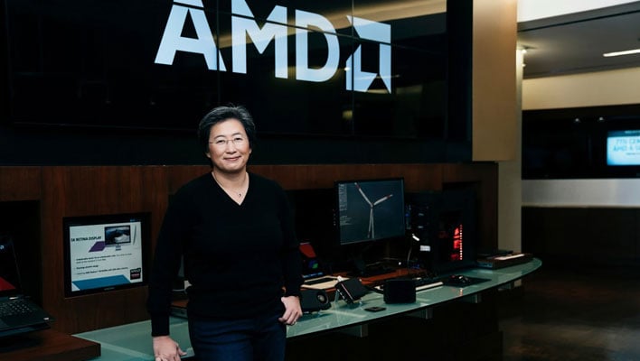 AMD Dr. Lisa Su in front a table with Ryzen PCs