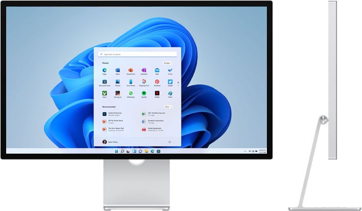 Apple Studio Display with a Windows 11 desktop background