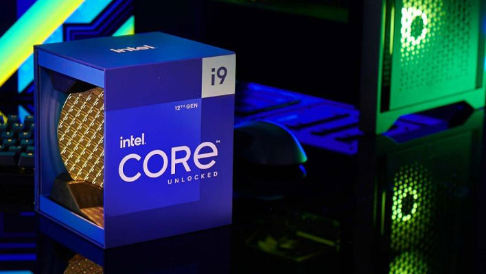 Intel Core i9 box on a desktop in front of a gaming PC