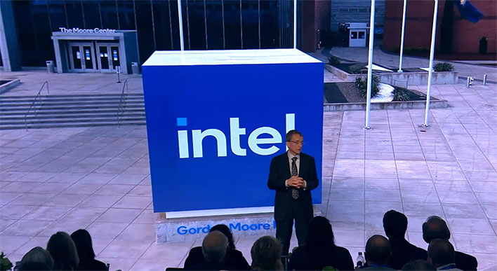 Intel CEO Pat Gelsinger in front of an Intel sign
