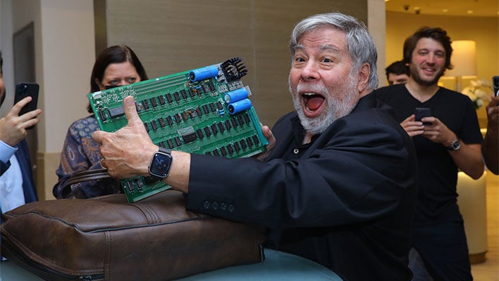 Steve Wozniak holding an Apple-1 computer