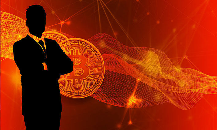 Silhoutte of a man in front of a bitcoin image