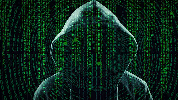 Hacker in a hoodie behind a Matrix-style foreground