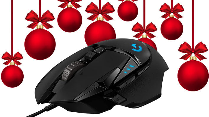 Logitech G502 Hero mouse with Christmas ball ornaments hanging in the background.