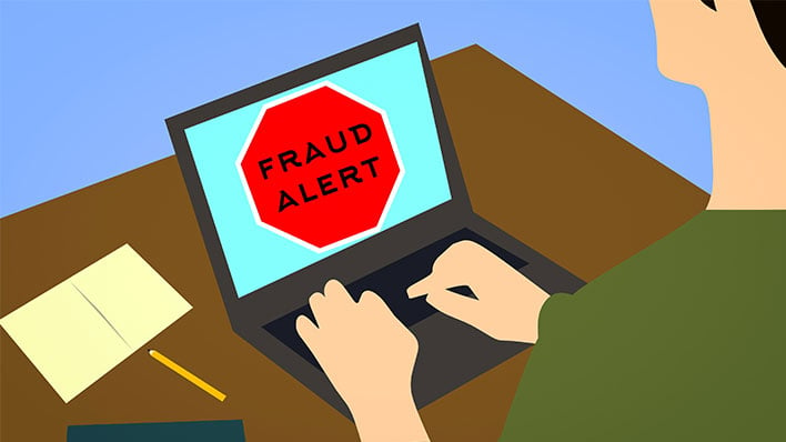 Cartoon laptop displaying a fraud alert.