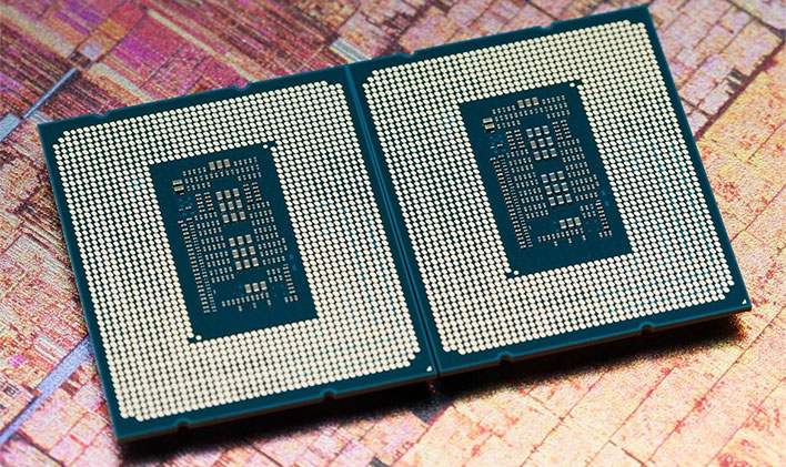 Backside of two Intel Alder Lake CPUs on top of a die shot background.