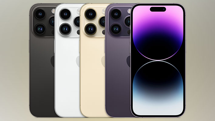 Several iPhone 14 handsets on a blurred background.