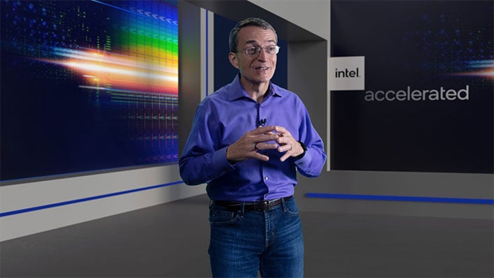 Intel CEO Pat Gelsinger in front of a wall with a wafer die image.