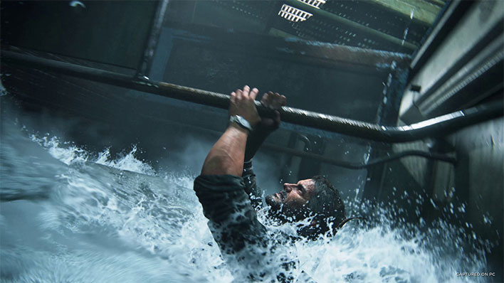 The Last of Us Part I screenshot showing Joel hanging onto a bar while submerged in water up to his neck.