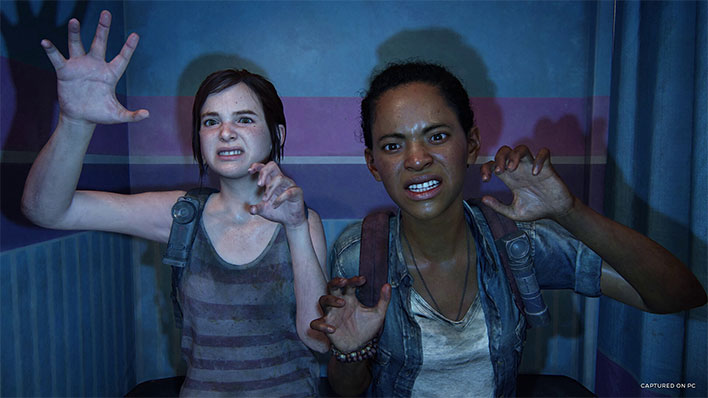 Ellie and Riley with raised hands in The Last of Us Part I.