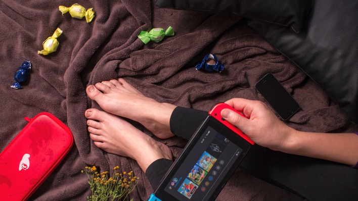 nintendo switch in bed