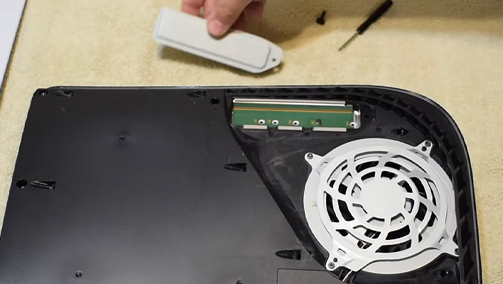 PlayStation 5's SSD slot with the heatshield removed.
