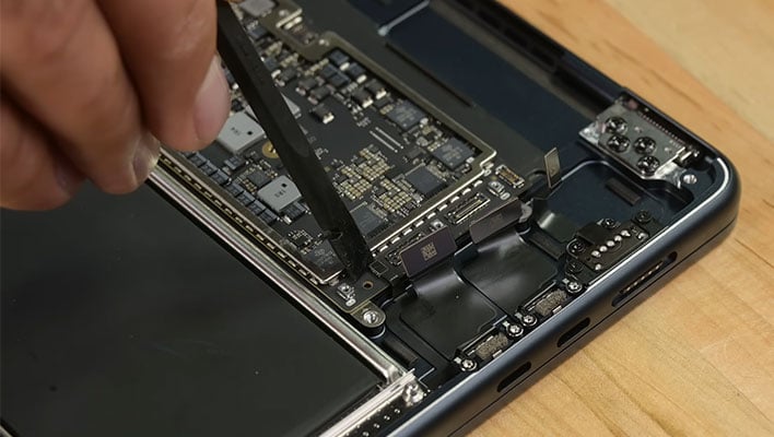 Inside of a MacBook Air 15 as it's being disassembled.