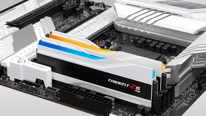 Two G.Skill White Trident Z5 RGB DDR5 modules installed in a white-themed motherboard.