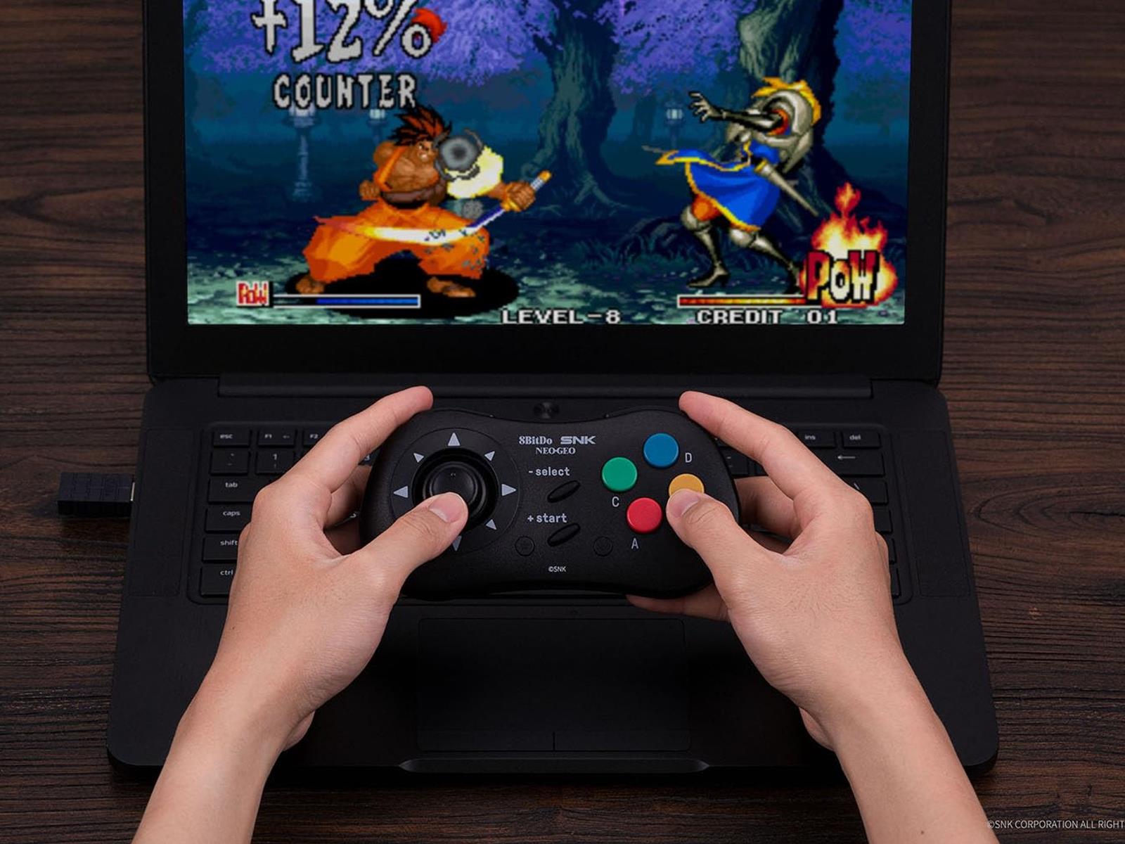 8BitDo's latest controller is a wireless take on the Neo Geo CD's gamepad -  The Verge