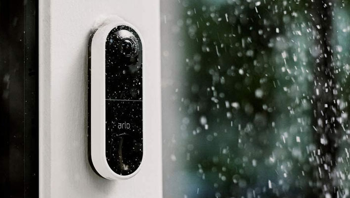 Arlo Video Doorbell on a home while it is raiining.