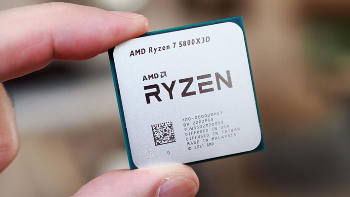 AMD Ryzen 7 5800X3D in between two fingers.
