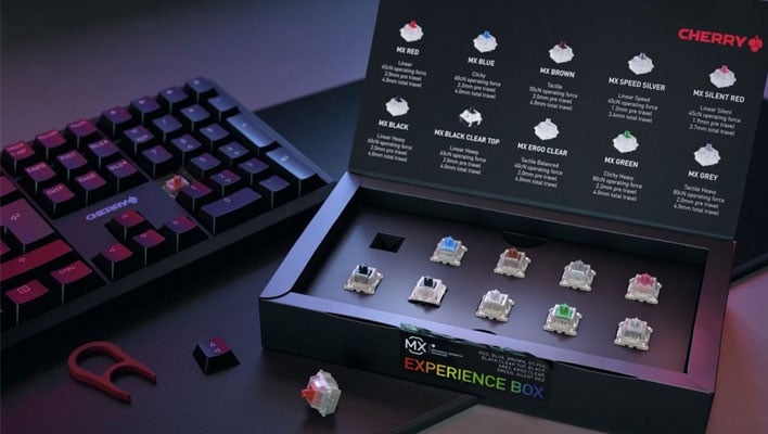 Cherry MX Experience box, opened and next to a keyboard.