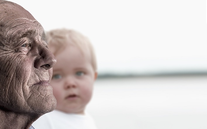 young child looking at older man