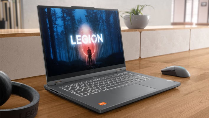 Lenovo Legion Slim 5 gaming laptop open and at an angle on a wood desk.