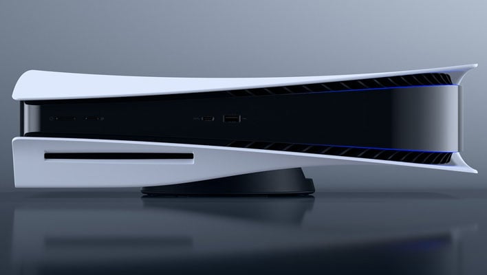 Sony PlayStation 5 laying horizontal on a gray gradient background.