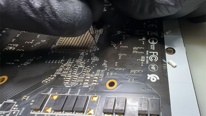 hero driling under a GPU to repair it