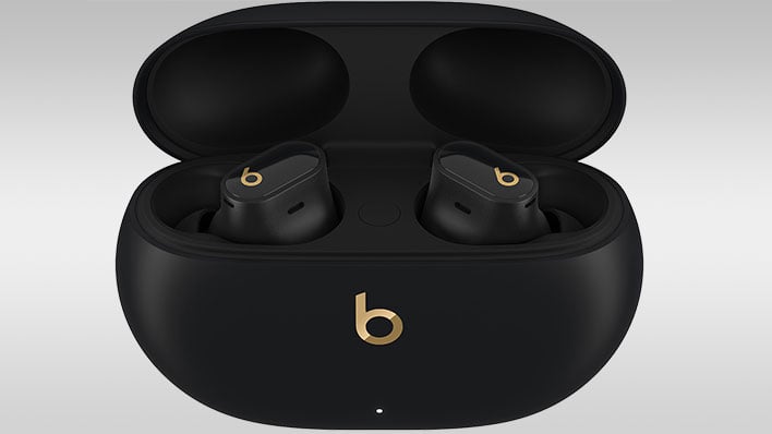 Beats Studio Buds Plus in charging case on a gray gradient background.