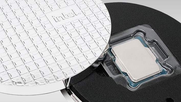 Intel CPU in a circular case with an Intel-branded lid off to the side.