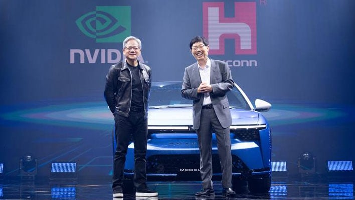 NVIDIA's Jensen Huang and Foxconn's Young Liu on stage in front of a car.