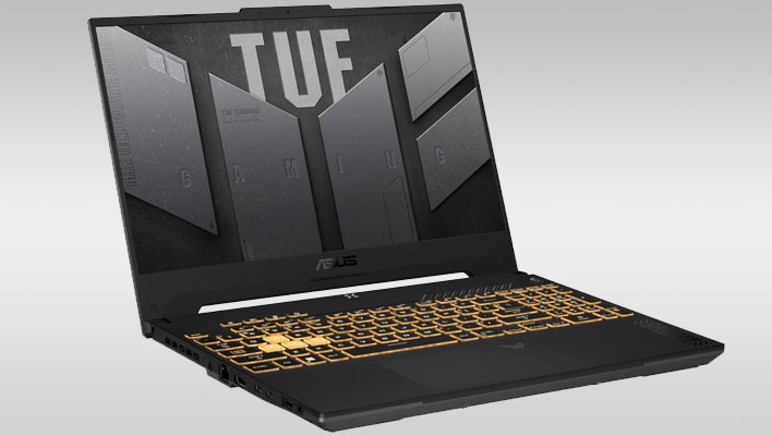 ASUS TUF Gaming laptop angled facing right on a gray gradient background.