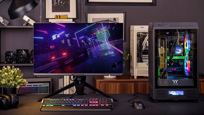 Thermaltake TGM-I27FQ monitor on a desk next to a PC tower.