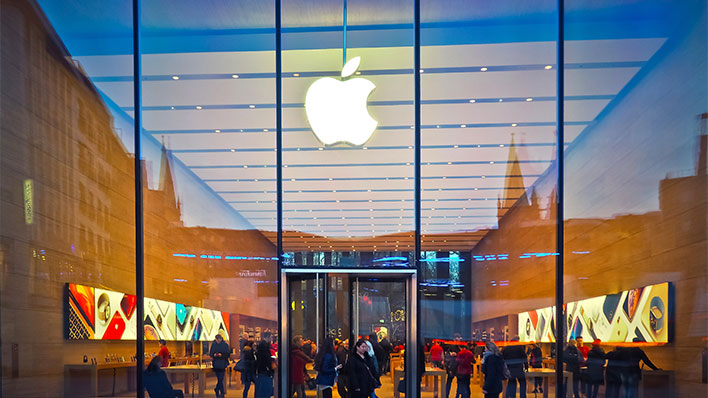 Apple Store with glass entrance and people inside.