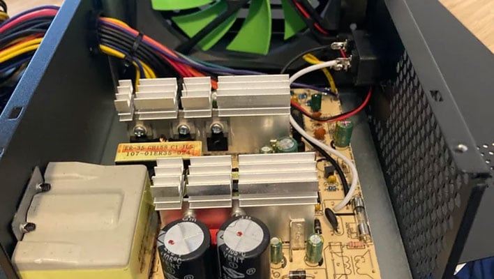 Inside view of a power supply unit (PSU) with its cover removed.