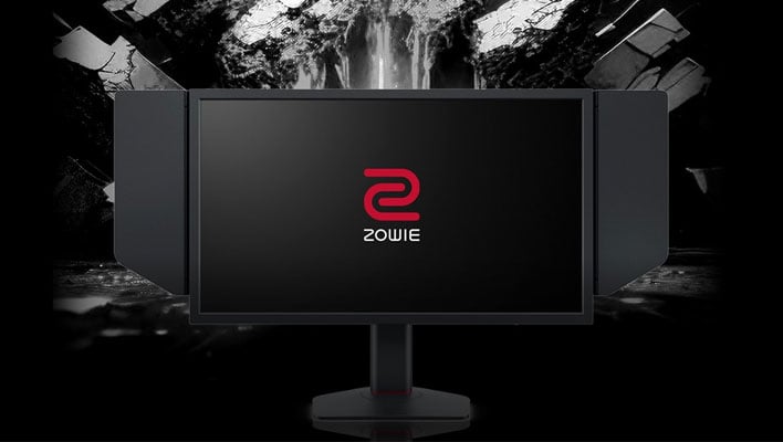 BenQ's Zowie XL2586X gaming monitor in front of a stone cliff background.