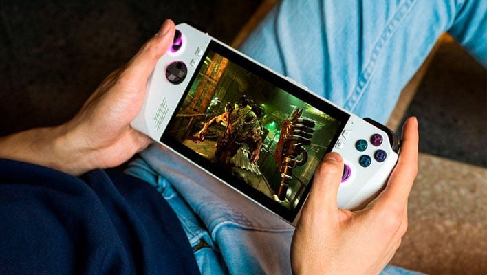 Man holding an ASUS ROG Ally gaming handheld over his lap.