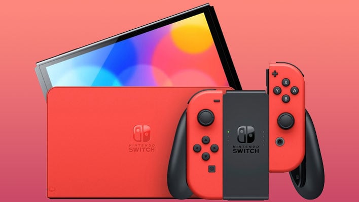 Nintendo Switch Mario Edition console on a light red gradient background.