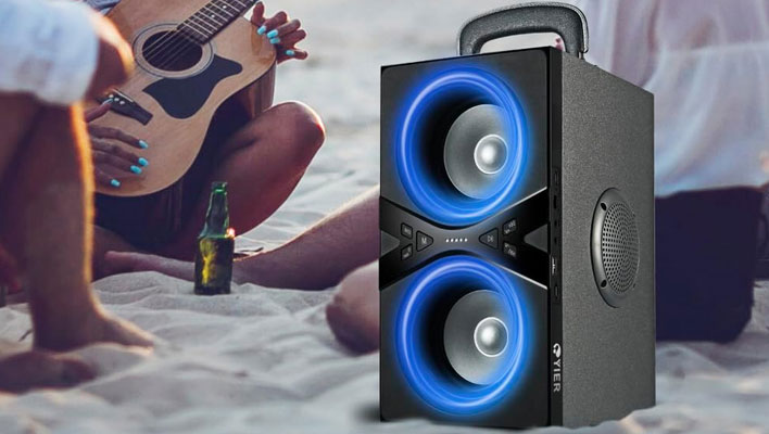 Yier portable speaker on a beach.