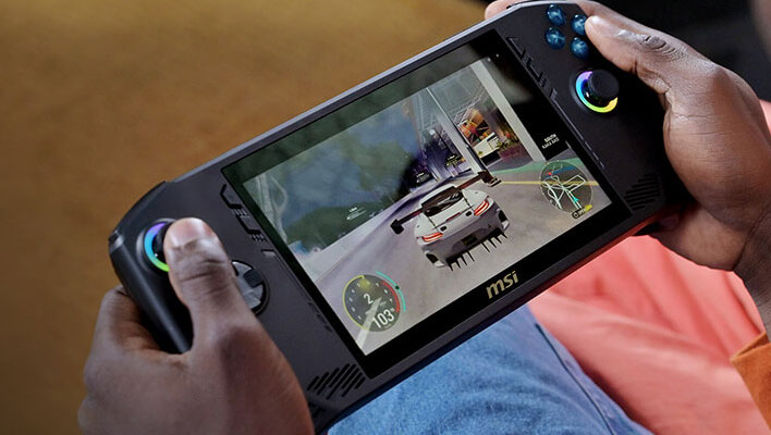 Holding an MSI Claw gaming handheld and playing a racing game.