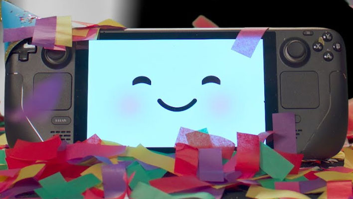 Steam Deck console with a smiling face on the screen, and surrouned by confetti.