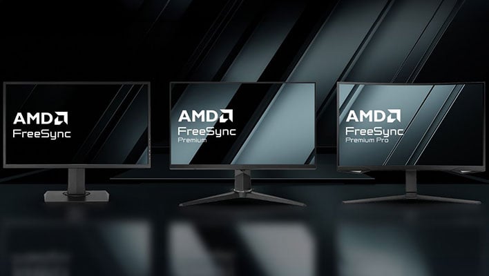 Three AMD FreeSync monitors on a black background and reflective surface.