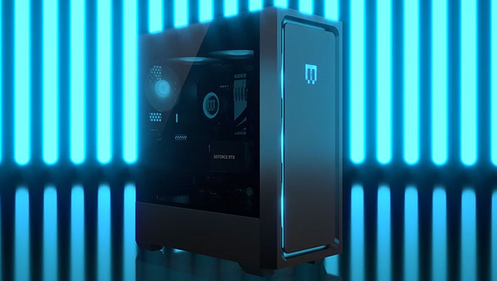 Maingear MG-1 gaming desktop with lights in the background.
