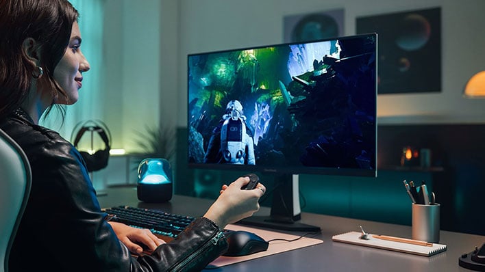 Girl playing a game on a ViewSonic XG272-2K-OLED gaming monitor.