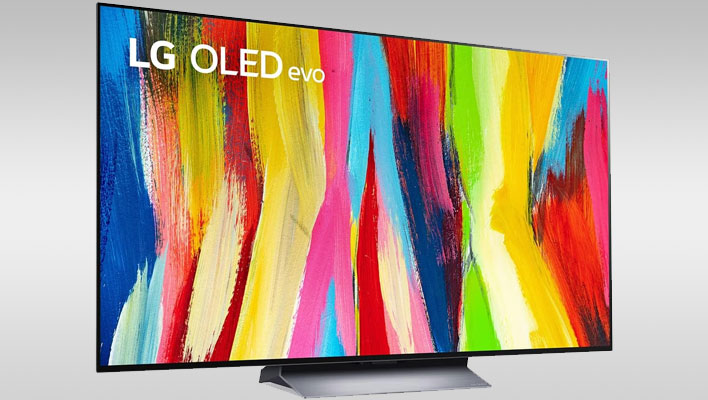LG C2 OLED Evo TV (angled) on a gray gradient background.