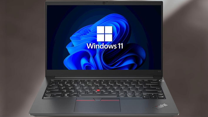 Lenovo ThinkPad E14 su uno sfondo sfumato grigio scuro.