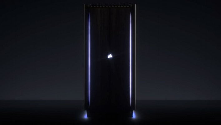 Dark teaser image of Corsair's upcoming One i500 gaming PC with LED lighting on the sides and bottom, and an illuminated Corsair logo on the front.