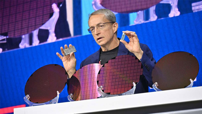 Intel CEO Pat Gelsinger next to wafers.